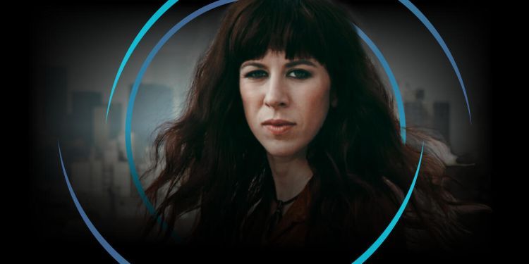 Missy Mazzoli with long dark brown hair and fringe