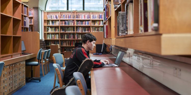 Student working in Guildhall School Library