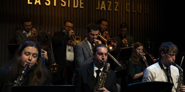 Big Band performing in front of Eastside Jazz sign