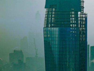 An image of a tower block and the City skyline 