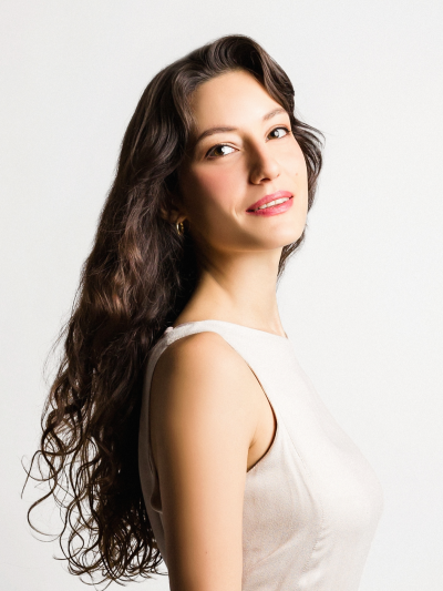 headshot of alexandra pouta in a white top