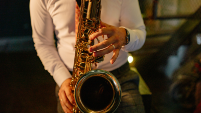 Close up of a student playing a saxophone